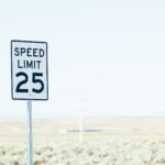 sign on roadside with speed limit